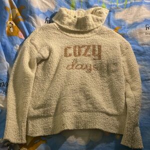 I’m selling a cozy warm sweater, size Medium it’s a cream brown